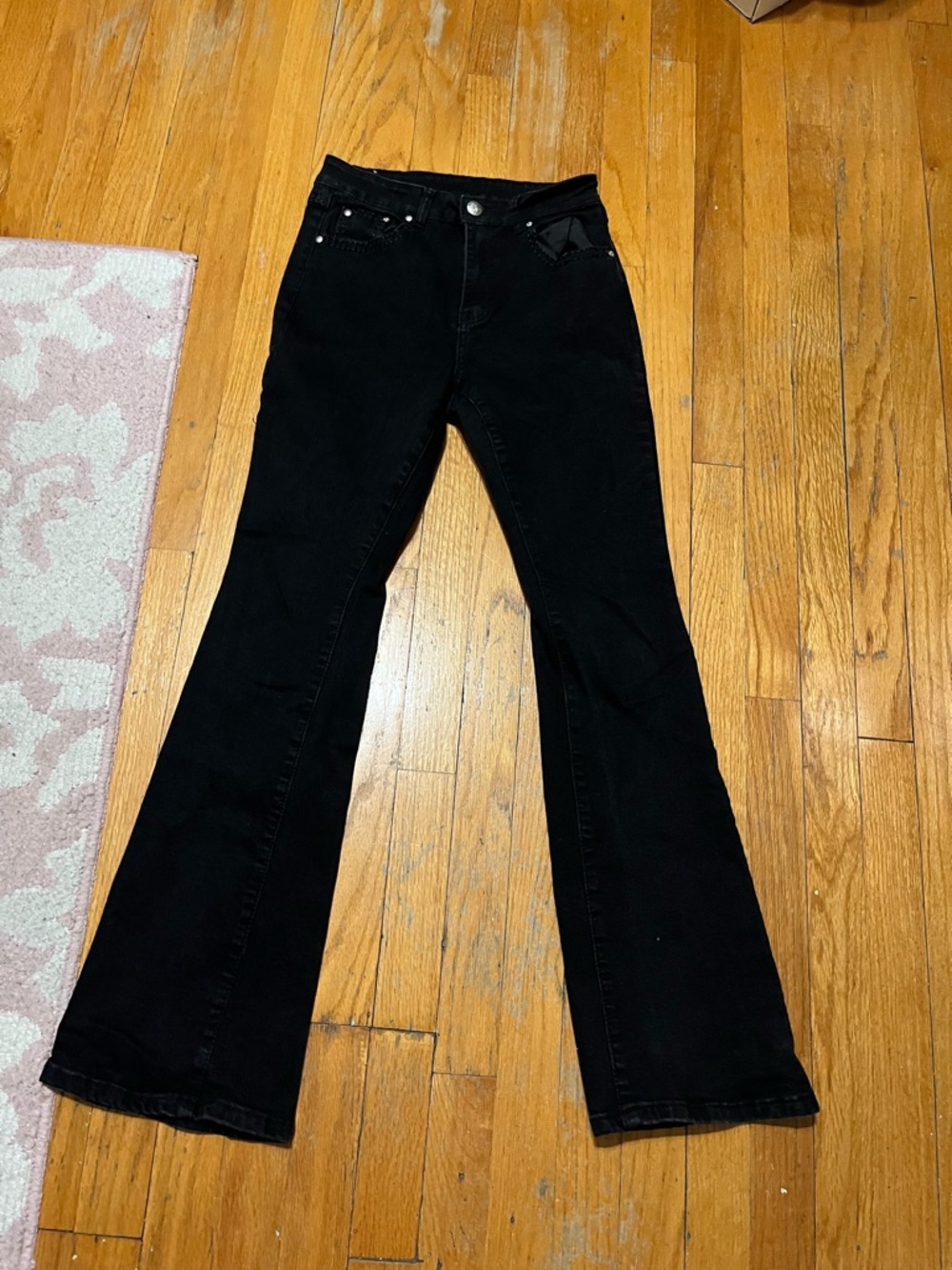 black flare jeans with rhinestoned back pockets